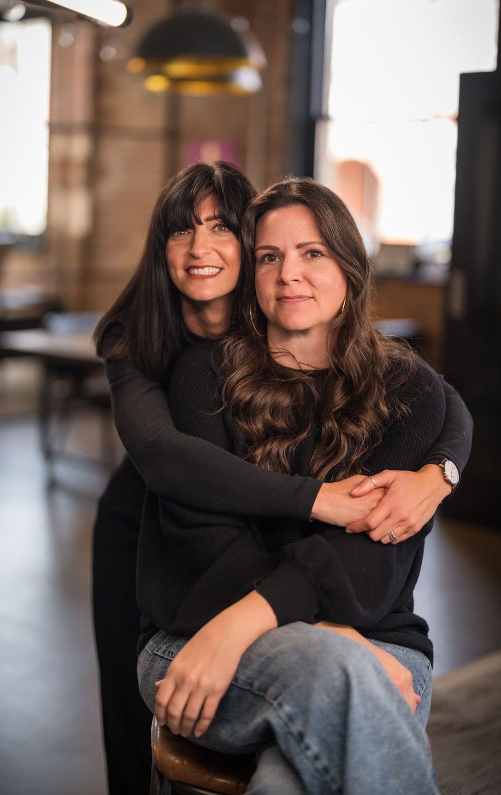 A woman with long dark hair, photographed on the Clic HQ filming day, September 2024