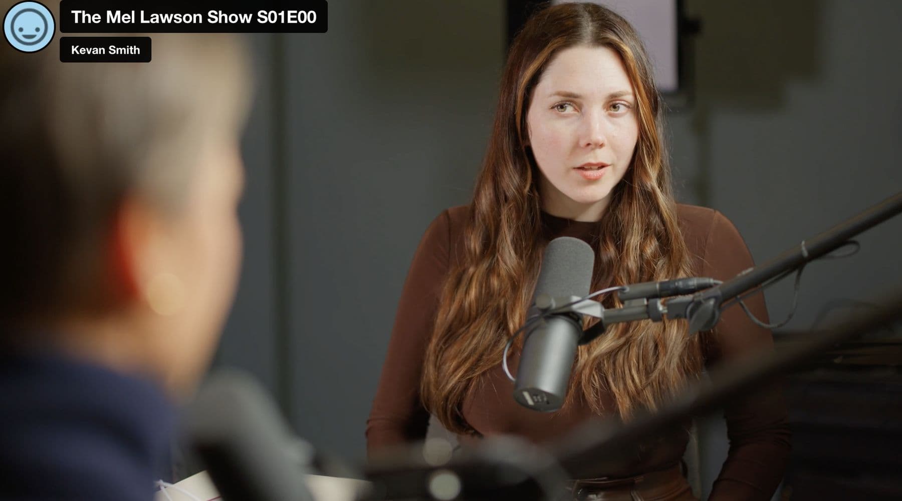 Liv Evans in the test recording on the set-up day, in the lighting she chose, with more depth in the background, as a still from the rough cut